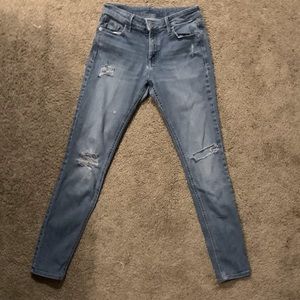 Girls/Tweens Old Navy blue ripped skinny jeans.